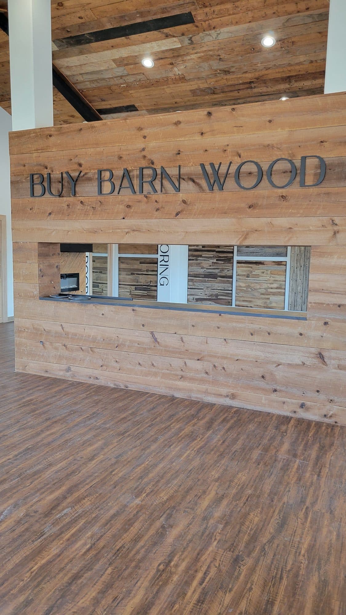 Reclaimed wood feature wall with dimensional lettering
